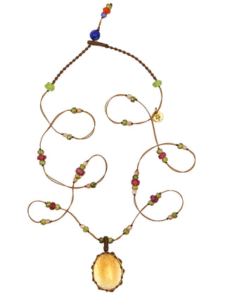 A micro-macrame necklace with a yellow citrine faceted pendant and pink tourmaline and zirconium beads.