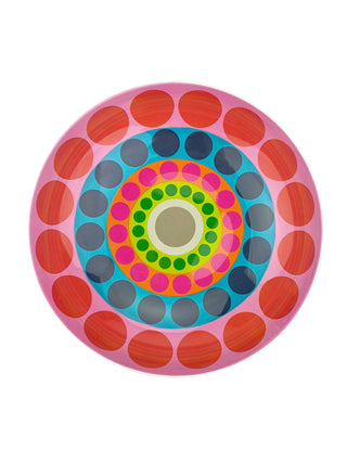 A colorful salad bowl with a pattern of concentric circles and dots.