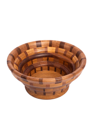 Overhead view of a segmented wooden bowl in different shades of brown.