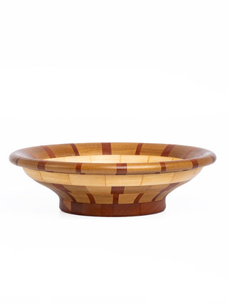 Profile view of a segmented wooden bowl in different shades of brown.