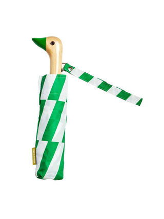 A folded green and white striped mini umbrella with a handle in the form of a duck's head, with a green beak.