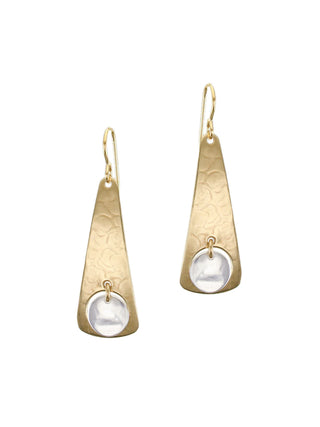 A pair of brass cutout long triangle earrings with a silver disc hanging in the center. 
