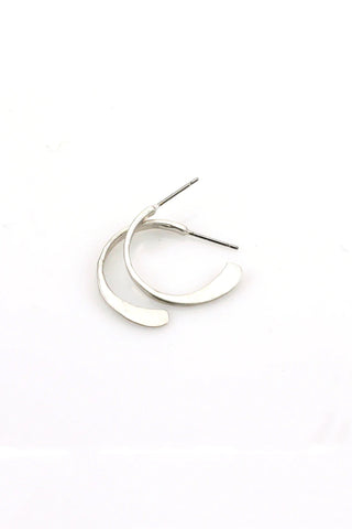 A pair of silver post earrings with subtle texture in a classic but unique crescent shape.