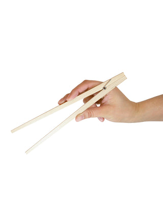 A hand holding a pair of wooden chopsticks with a hinge for ease of use.