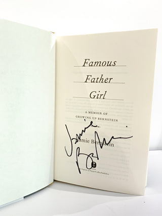 A title page of a book that reads Famous Father Girl above, with a signature below.