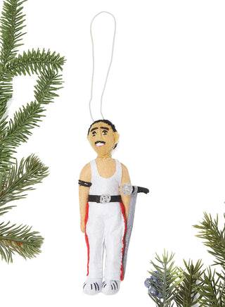 A felt ornament of Freddie Mercury dressed in white with a microphone, surrounded by Christmas tree branches.
