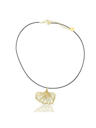 A short necklace with a gold pendant in the shape of a gingko leaf.