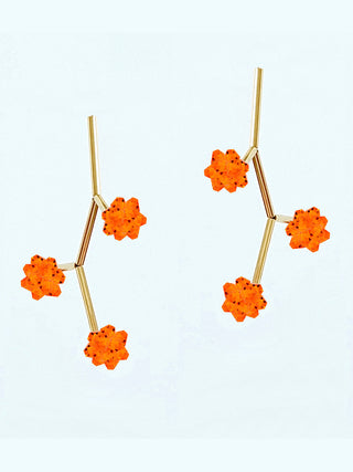 Earrings with gold-plated brass stems and three orange crystals.