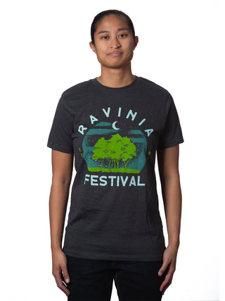 A young woman wearing a t-shirt that reads, Ravinia Festival, with a rendition of moon over green trees.