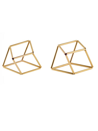 Two different geometric shapes of a gold bracelet.