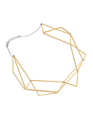 A gold necklace with an origami shape and silver chain.