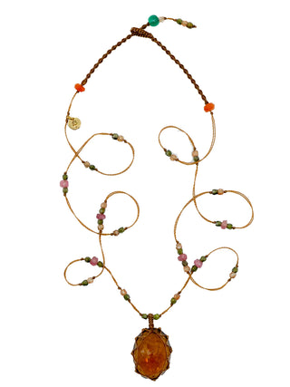 A micro-macrame necklace with a honey quartz faceted pendant and pink tourmaline and zirconium beads.