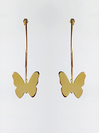 Gold earrings in the shape of a butterfly.