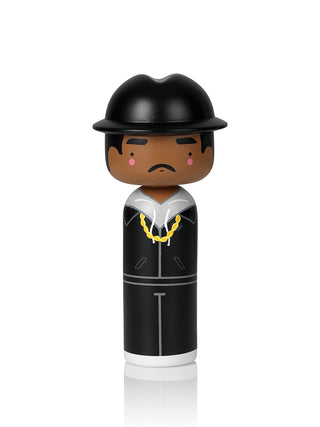 Joseph Simmons of RUN DMC as a wooden doll, dressed in black with a gold chain.
