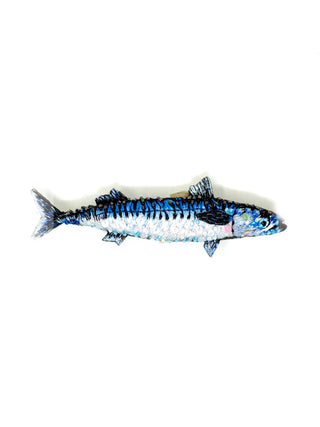 An embroidered brooch in the form of a blue and white king mackerel.