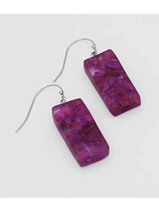Angled view of Earrings made of rectangular purple resin bead dangle from a two inch French wire.