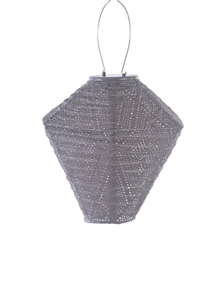 A diamond-shaped taupe lantern, made of Tyvek fabric, with a handle for hanging.