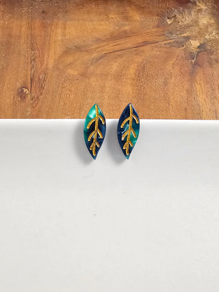 A pair of dark green leaf stud earrings with gold veins.