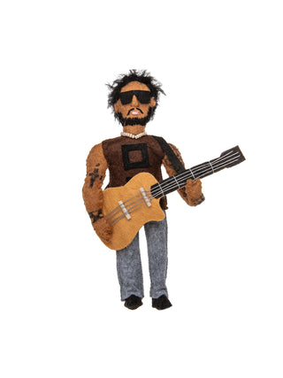 A felt ornament that looks like Lenny Kravitz holding a guitar.