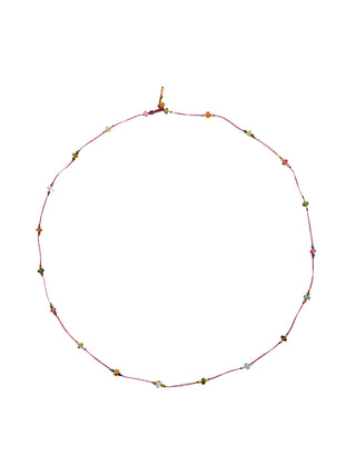 A short micro-macrame necklace with an eggplant colored thread and a repeating sequence of 3 tourmaline beads.