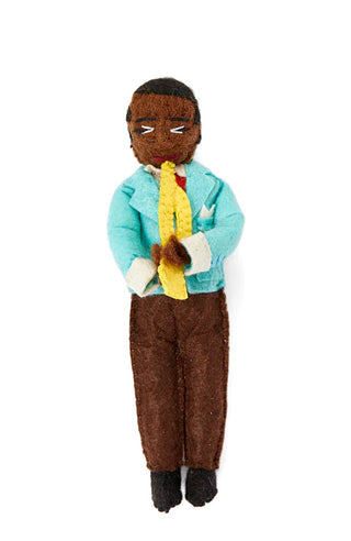 A felt ornament depicting Louis Armstrong playing the trumpet.