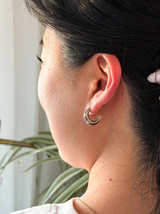 A model wearing the silver Luxe Selena Hoops.
