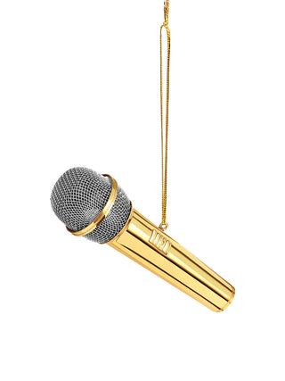 An ornament in the shape of a golden microphone, hanging on a golden string.