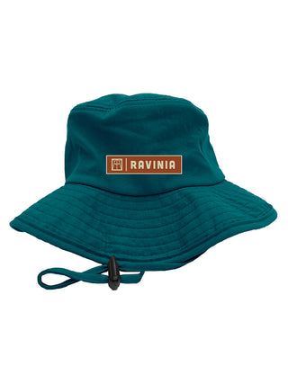 A green wide-brim hat witha  brown Ravinia logo and adjustable chin strap.