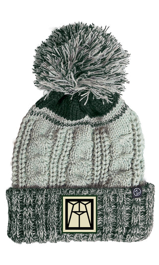 A grey beanie with the Ravinia logo on the brim and and a pompon at the top.