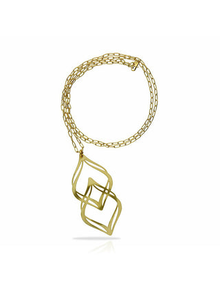 A gold necklace with a pendant shaped like two pointed ovals overlapping, on a coiled gold chain.
