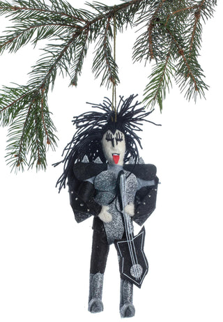 A felt ornament of Gene Simmons from KISS in full dress, hanging from a holiday tree branch.