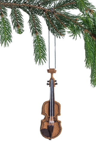 A violin ornament made of felt, hanging from a Christmas tree branch.