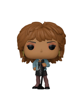 A vinyl figure of Tina Turner in a black dress, and a blue jacket, holding a microphone and stand.