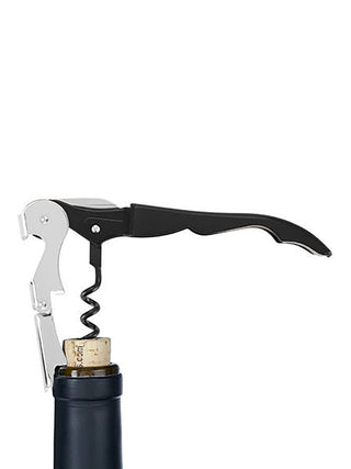 A black corkscrew opening a bottle of wine.
