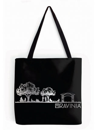 A black tote bag accented with metallic silver: with people lounging on the lawn under trees, the Tyler Gate on the right, and the word Ravinia underneath.