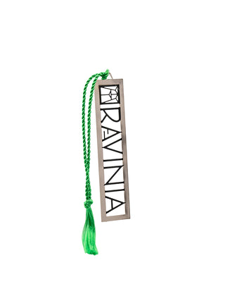 A metal bookmark with a green tassel that says Ravinia in black letters.