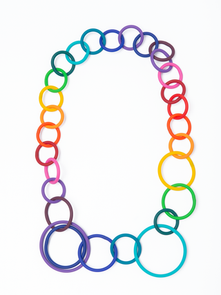 A chain necklace, flat, made of multicolored plastic.