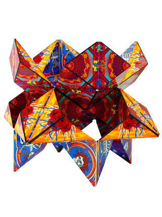 A geometric shape featuring the Grateful Dead's skull with roses design, in blue, orange and red.