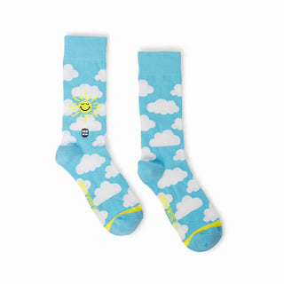 Sky blue socks with a yellow smiling sun and white clouds.