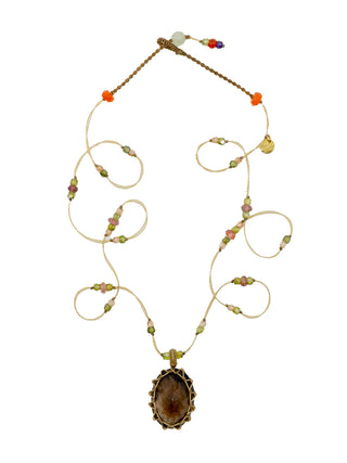 A micro-macrame necklace with a smoky quartz pendant and pink tourmaline and zirconium beads on a beige colored thread.