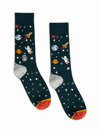 A pair of navy blue socks adorned with images of start, rockets, astronauts, and planet earth.