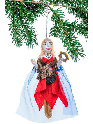 A felt ornament that looks like Stevie Nicks in a red dress with a blue cape and a tambourine.
