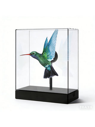 A clear holographic display box projecting an image of a hummingbird.