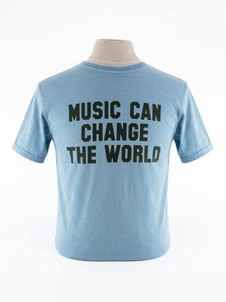 A light blue t-shirt on a mannequin, with the words "Music Can Change The World" on the front.
