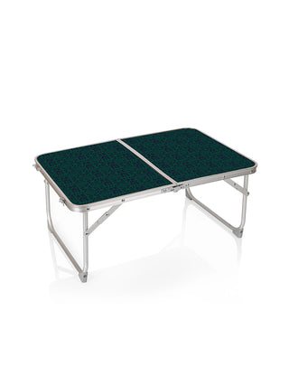 Foldable metal concert table with a green and navy Ravinia inspired print.