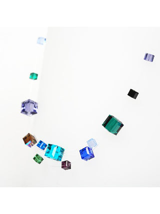 A necklace made of multicolored crystal cubes on nylon threads.