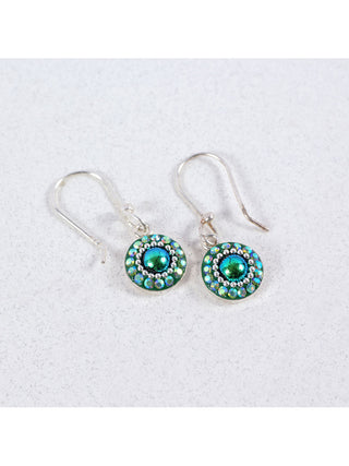 A pair of bedazzled crystal circle earrings on wire hooks.