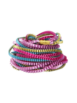A fuschsia, turquoise, gold, and lilac colored multi-strand pleated fabric necklace, coiled.