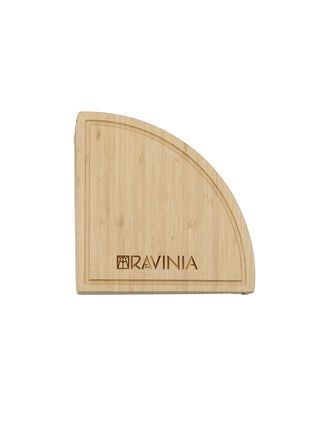 A Ravinia branded bamboo cheese board in the shape of a wedge.