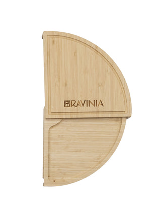 A Ravinia branded bamboo cheese board in the shape of a half-circle.